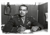 Photo of Lt. Col William R. Thompson at desk