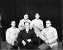 Photo of model prisoners with an official at Joliet